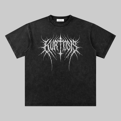 Front view of the KURTOSIS ‘IN EXTREMIS EXISTERE III’ washed black oversized t-shirt. Features a vintage mineral wash finish with subtle tonal degradation and a distorted black metal typography chest graphic, evoking a degraded signal across a structural cotton blend matrix.